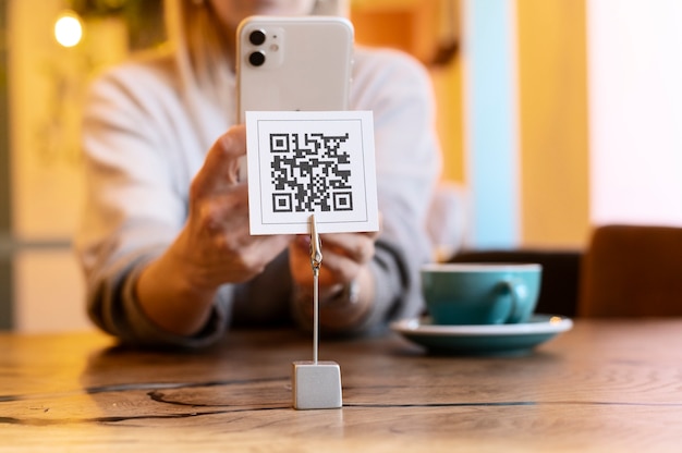 Person scanning qr code