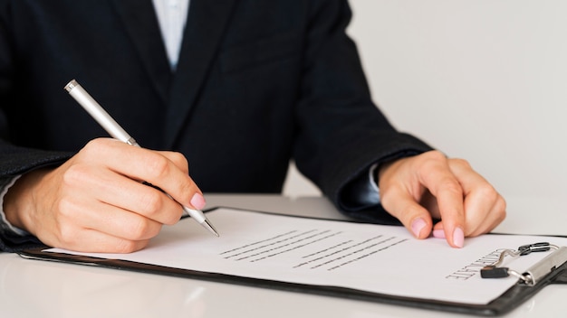 Person signing a certificate front view