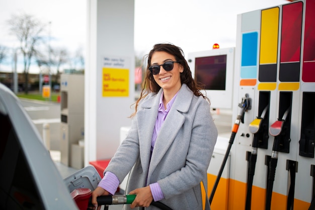 Free photo person spending time at the gas station