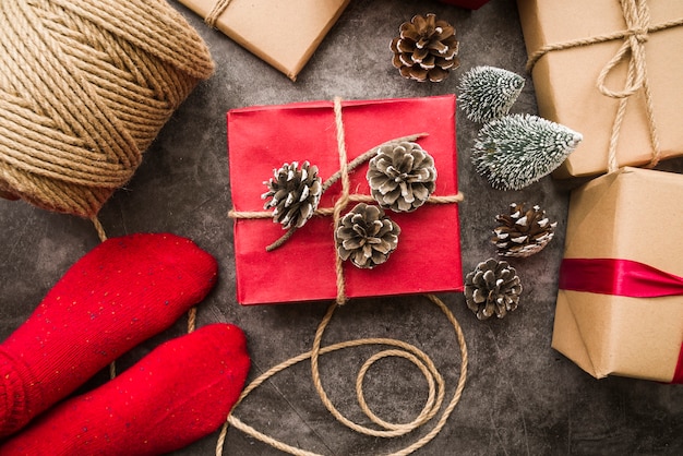 Free photo person standing on floor with different gift boxes