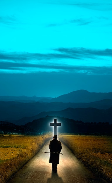 Person standing in front of cross sign