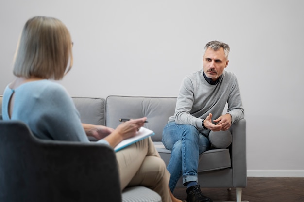 Person suffering from ptsd at psychologist