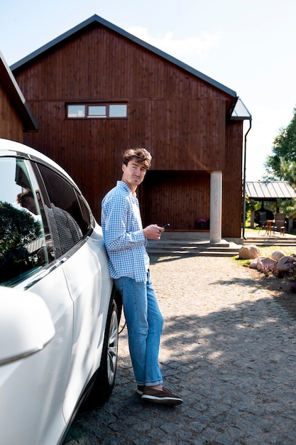 Free photo person taking care of electric car