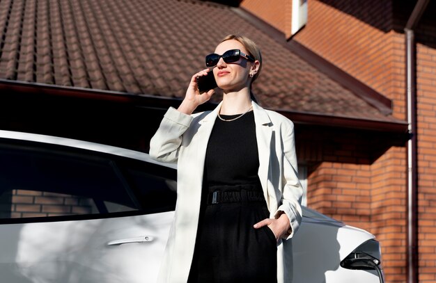 Free Photo person taking care of electric car