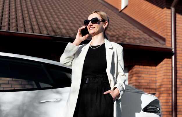 Free Photo person taking care of electric car