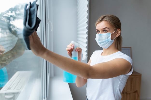 Free photo person taking care of office cleaning