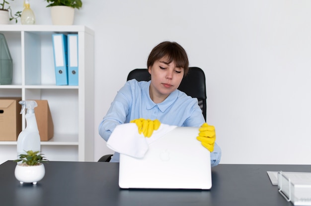 Free photo person taking care of office cleaning