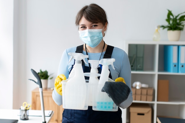 Free photo person taking care of office cleaning