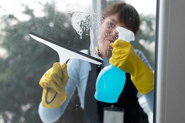 Free photo person taking care of office cleaning