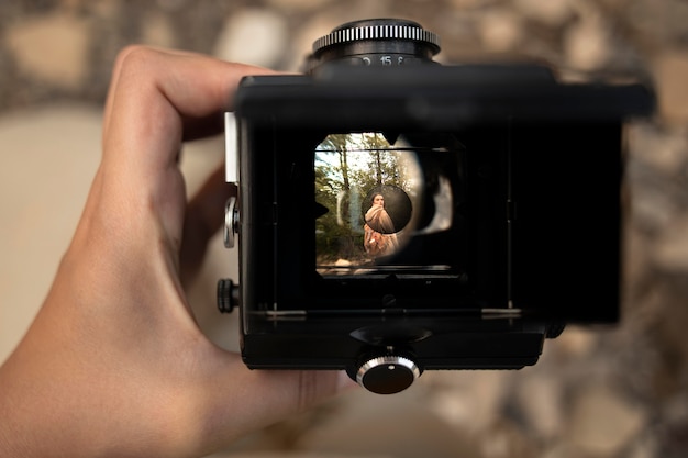 Person taking a photo of a friend traveler