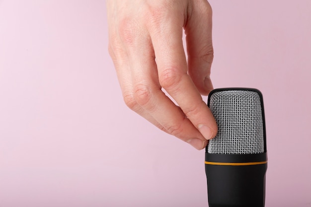 Free photo person touching microphone for asmr