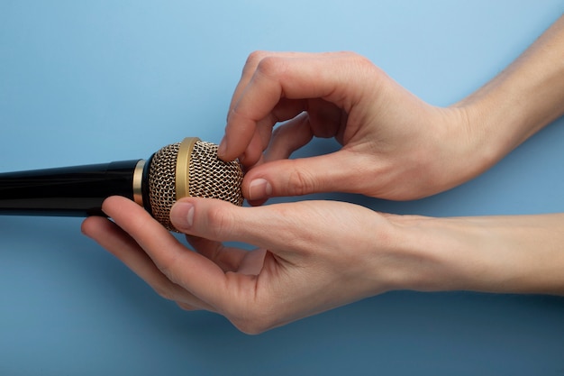 Person touching microphone for asmr