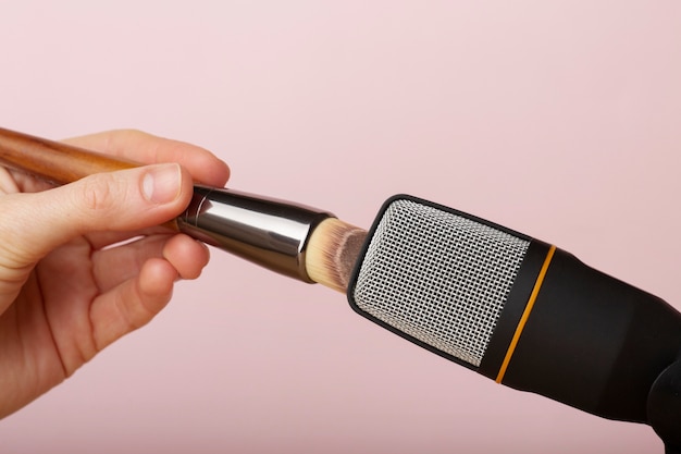 Person using brush close to microphone for asmr