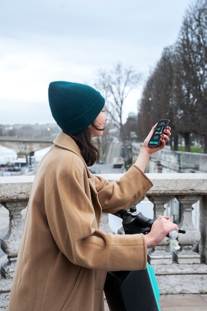 Free photo person using electric scooter in the city