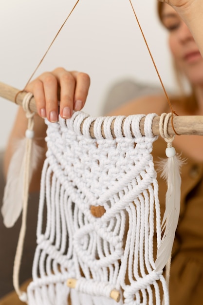 Free photo person using the macrame technique at home