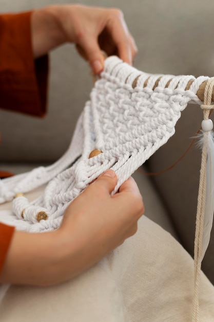 Person using the macrame technique