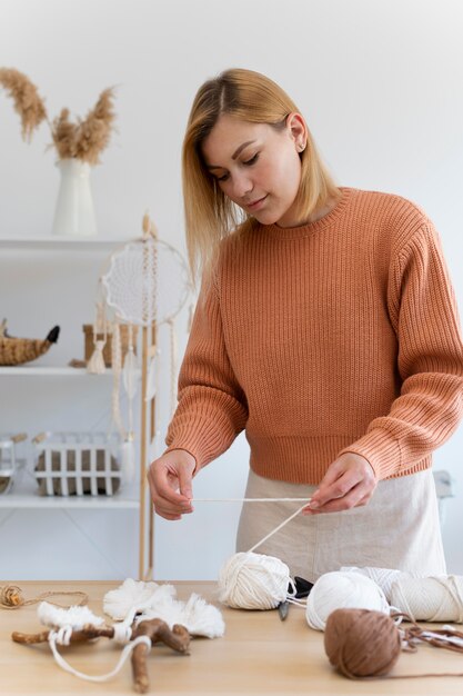 Person using the macrame technique