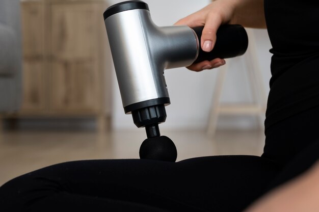 Person using massage gun