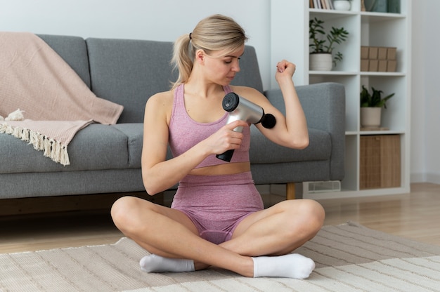 Person using massage gun