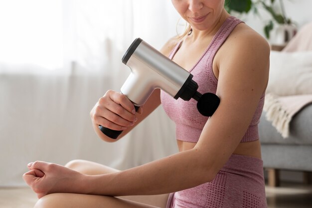 Person using massage gun