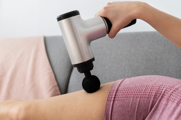 Person using massage gun