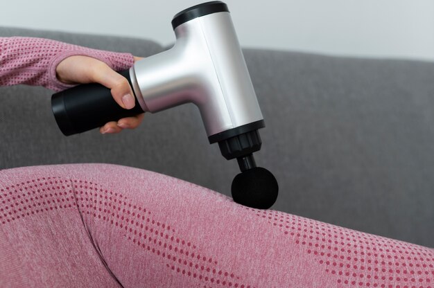 Person using massage gun