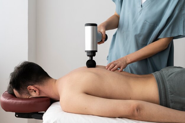 Person using massage gun