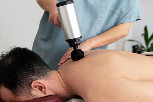 Person using massage gun