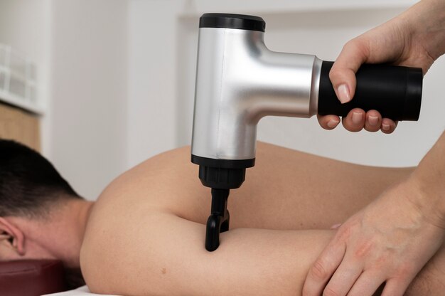 Person using massage gun