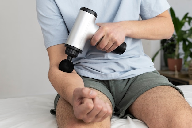 Person using massage gun