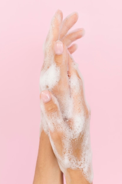 Person washing hands with soap