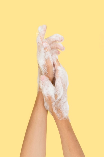 Person washing hands with soap