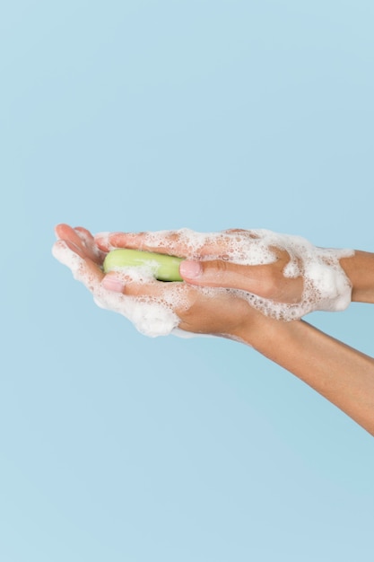 Free photo person washing hands with soap