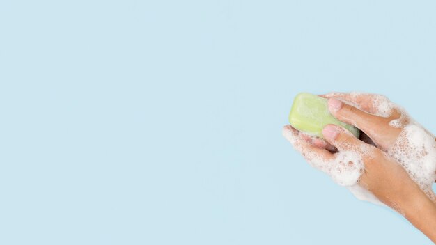 Person washing hands with soap