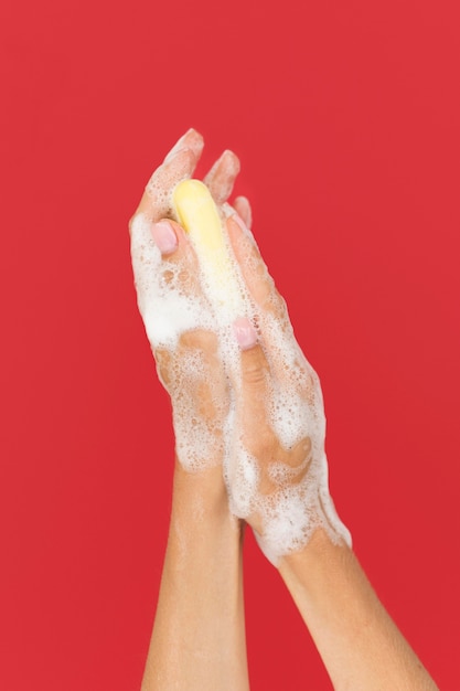 Free photo person washing hands with soap