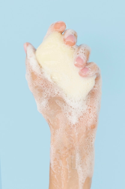 Person washing hands with soap