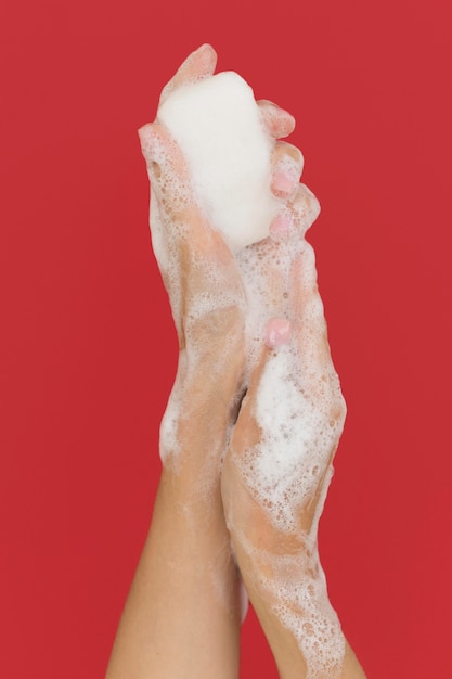 Person washing hands with soap