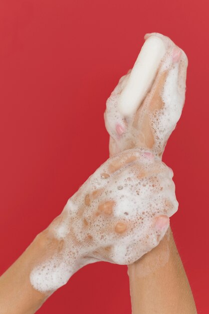 Person washing hands with soap