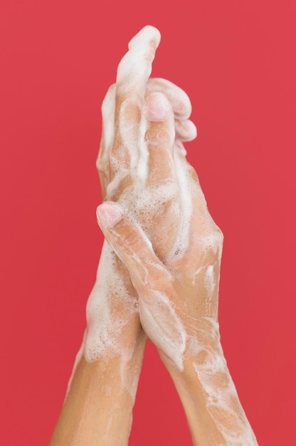 Free photo person washing hands with soap