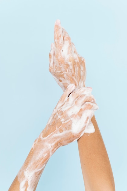 Person washing hands with soap