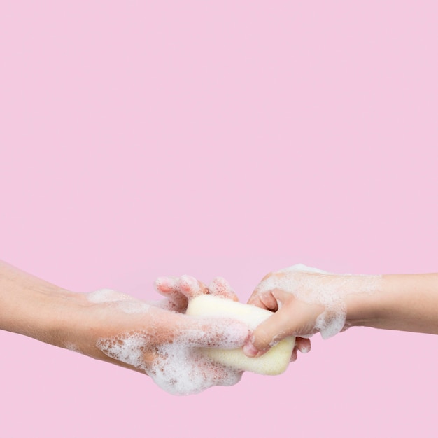 Person washing hands with soap