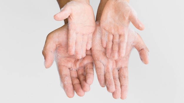 Person washing hands with soap