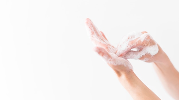 Person washing hands with soap