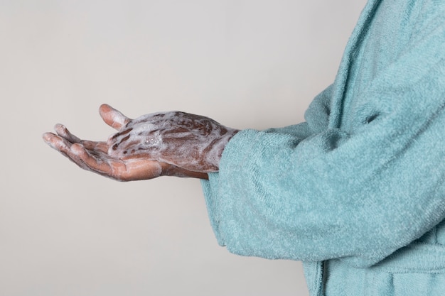 Person washing hands with soap