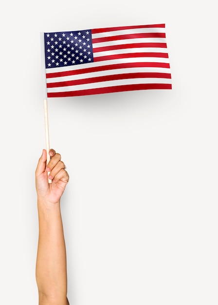 Person waving the flag of the United States of America