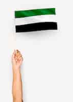 無料写真 アフガニスタンのイスラム国旗を振っている人