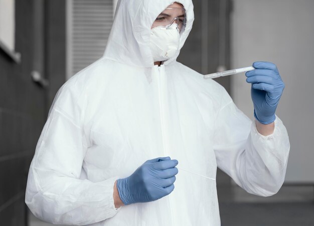 Person wearing a protective equipment against a bio-hazard