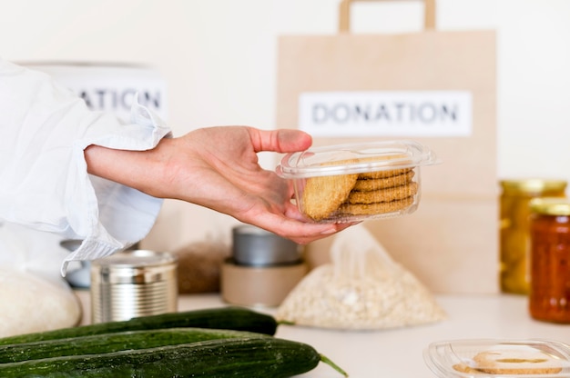 Free photo person with donated food