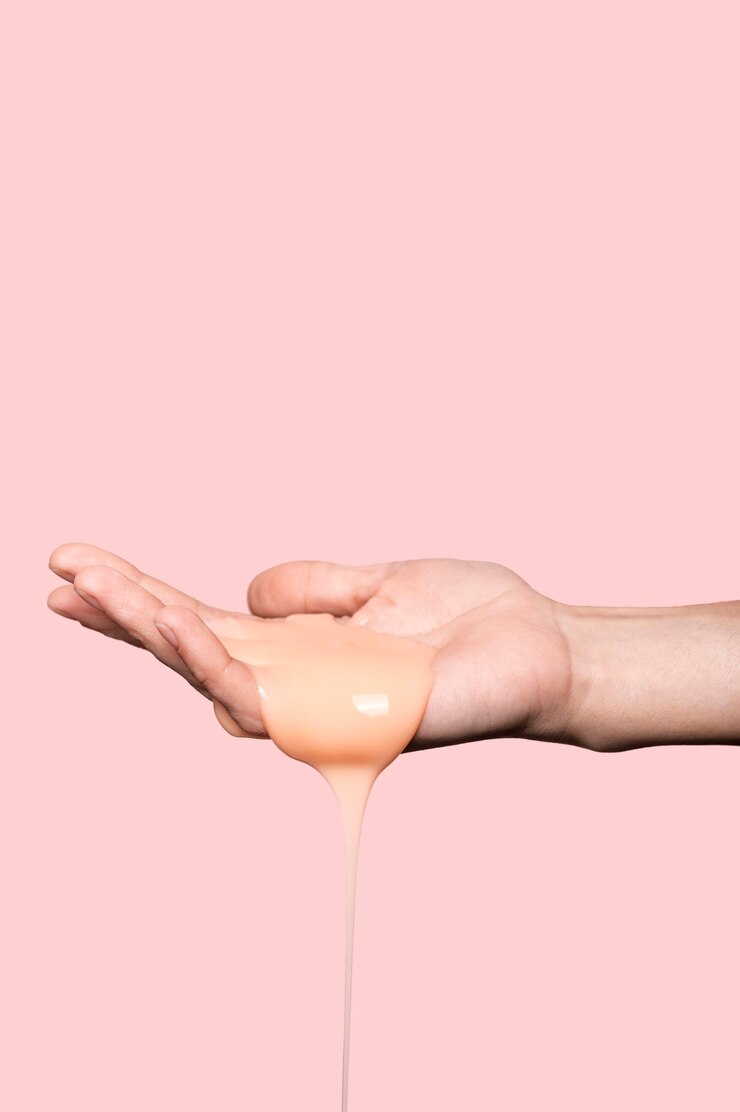 Free Photo person with orange liquid soap
