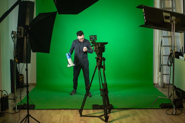 A person with speaker in studio